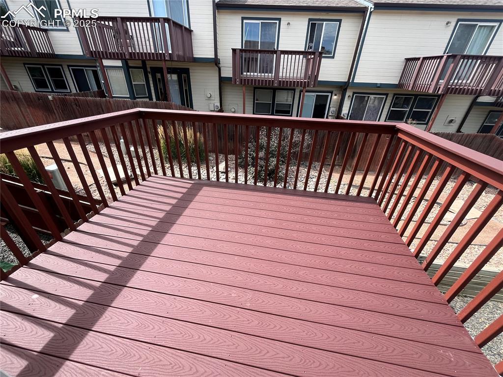 718 Mediterranean Point Colorado Springs, CO 80910 - Photo 13 of 28 a balcony with view of wooden floor and stairs