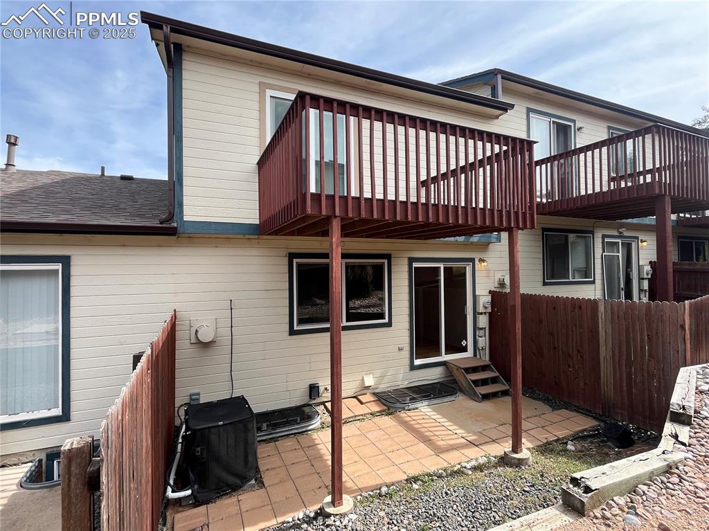 718 Mediterranean Point Colorado Springs, CO 80910 - Photo 28 of 28 a view of a house with a wooden deck