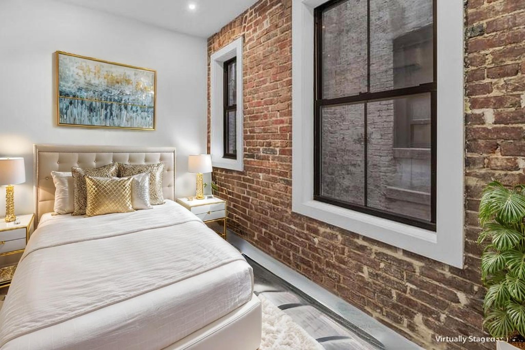 356 West 48th Street, Unit 2C Manhattan, NY 10036 - Photo 7 of 25 a bedroom with a bed and a window