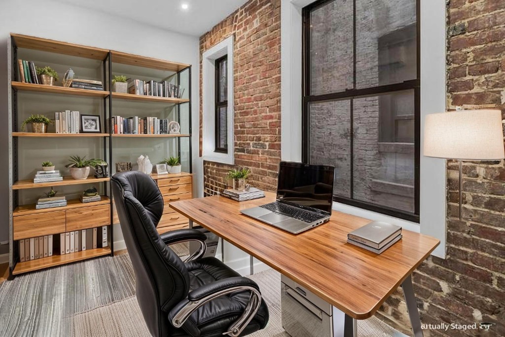 356 West 48th Street, Unit 2C Manhattan, NY 10036 - Photo 8 of 25 a view of a workspace with furniture and a book shelf