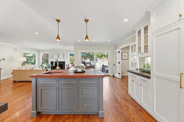 a view of living room with furniture and wooden floor