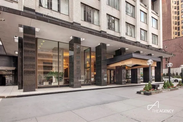 a swimming pool with outdoor seating yard and furniture