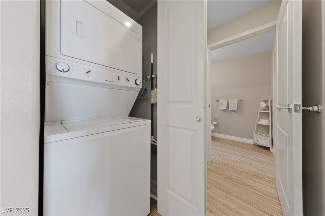 8255 South Las Vegas Boulevard, Unit 809 Las Vegas, NV 89123 - Photo 12 of 32 Washroom featuring stacked washer and clothes drye