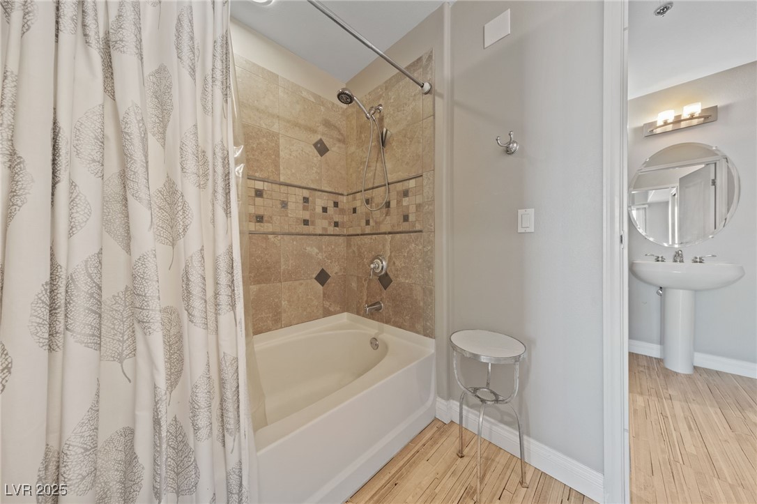 8255 South Las Vegas Boulevard, Unit 809 Las Vegas, NV 89123 - Photo 14 of 32 Full bathroom with shower / bath combo and wood fi