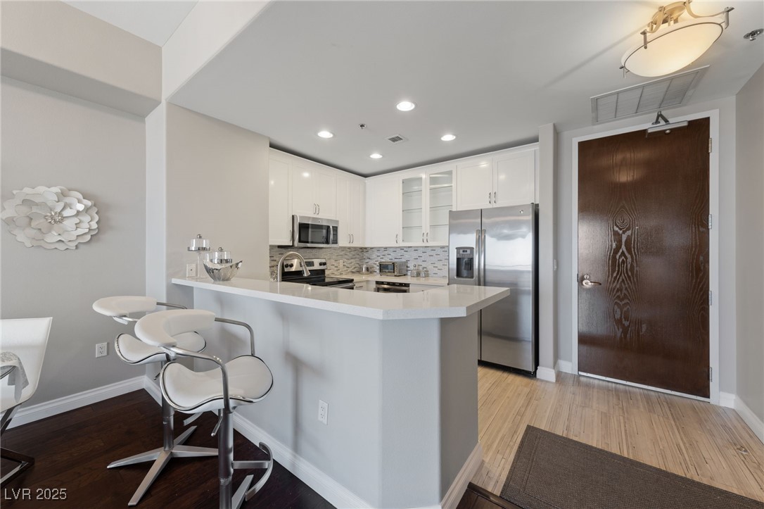 8255 South Las Vegas Boulevard, Unit 809 Las Vegas, NV 89123 - Photo 2 of 32 Kitchen featuring stainless steel appliances, ligh
