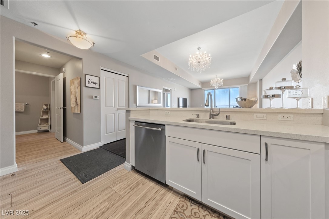 8255 South Las Vegas Boulevard, Unit 809 Las Vegas, NV 89123 - Photo 9 of 32 Kitchen featuring dishwasher, a chandelier, light