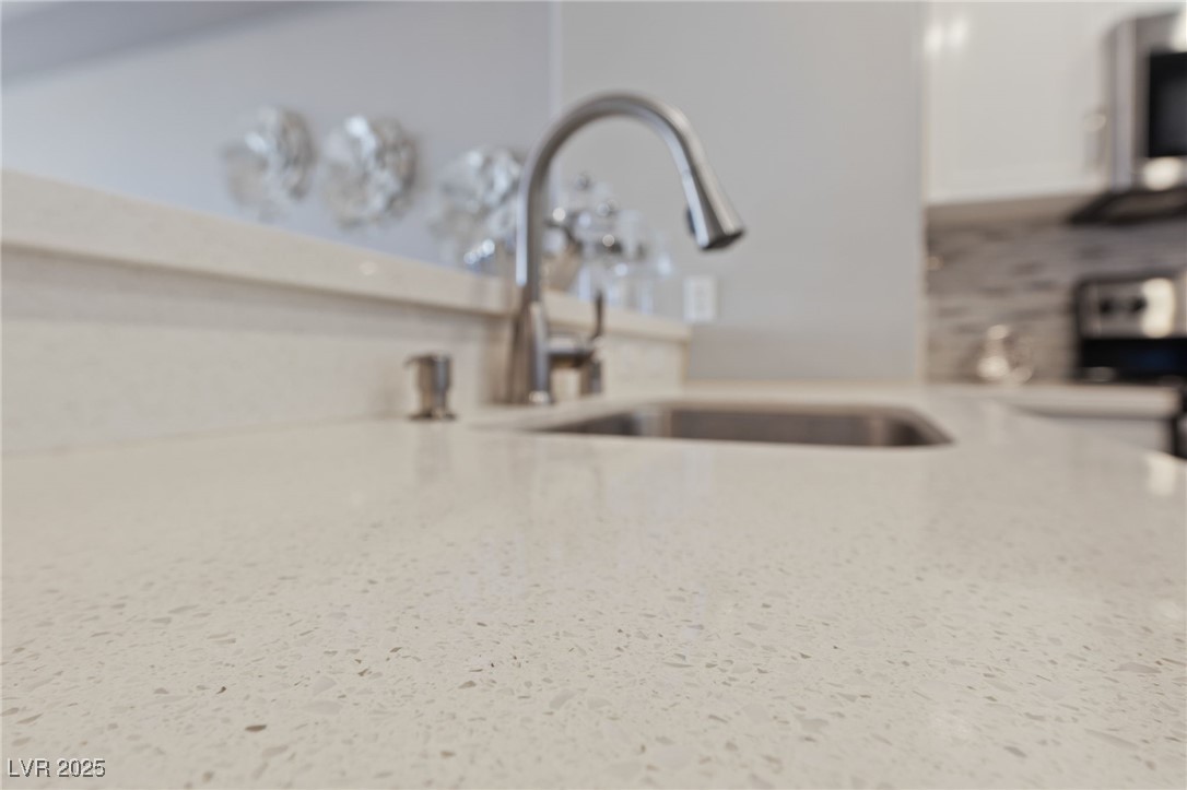 8255 South Las Vegas Boulevard, Unit 809 Las Vegas, NV 89123 - Photo 10 of 32 Detailed view of light countertops and a sink