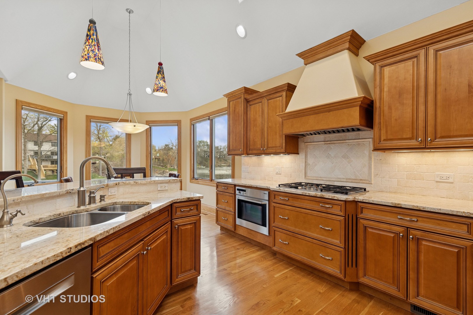 6107 Lake Shore Drive Cary, IL 60013 - Photo 17 of 40 a kitchen with stainless steel appliances granite countertop a sink and a stove