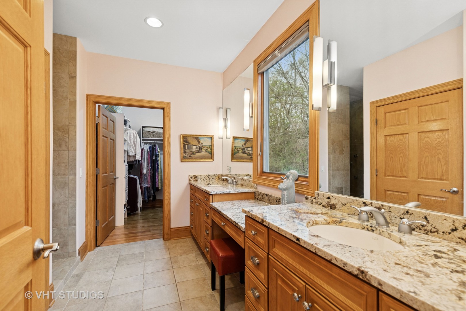 6107 Lake Shore Drive Cary, IL 60013 - Photo 19 of 40 a bathroom with a granite countertop sink and a mirror