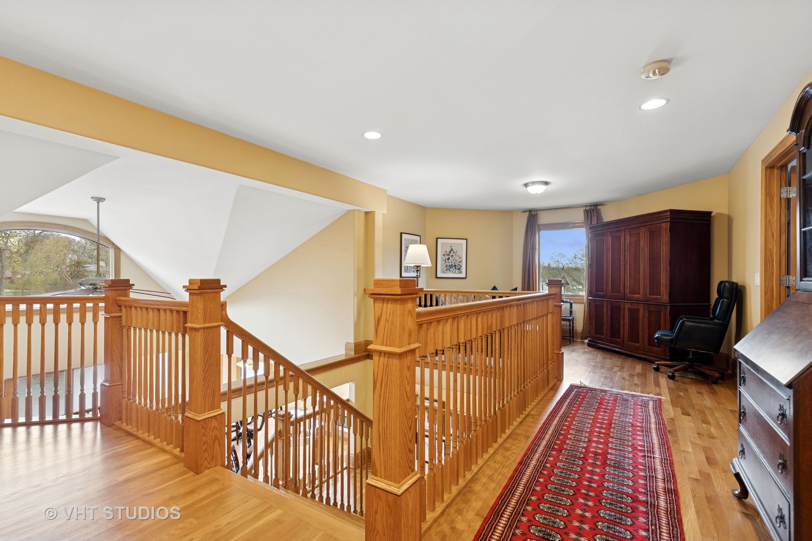 6107 Lake Shore Drive Cary, IL 60013 - Photo 22 of 40 a view of a hallway with wooden floor and stairs