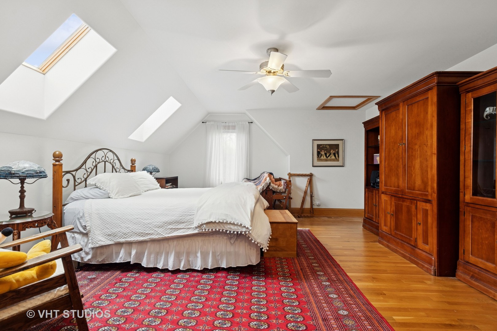 6107 Lake Shore Drive Cary, IL 60013 - Photo 24 of 40 a bed room with a bed and a chandelier