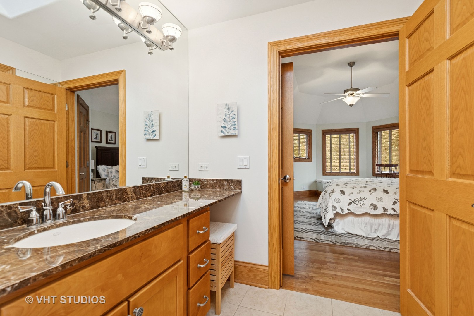6107 Lake Shore Drive Cary, IL 60013 - Photo 26 of 40 a en suite bathroom with a granite countertop sink and a mirror
