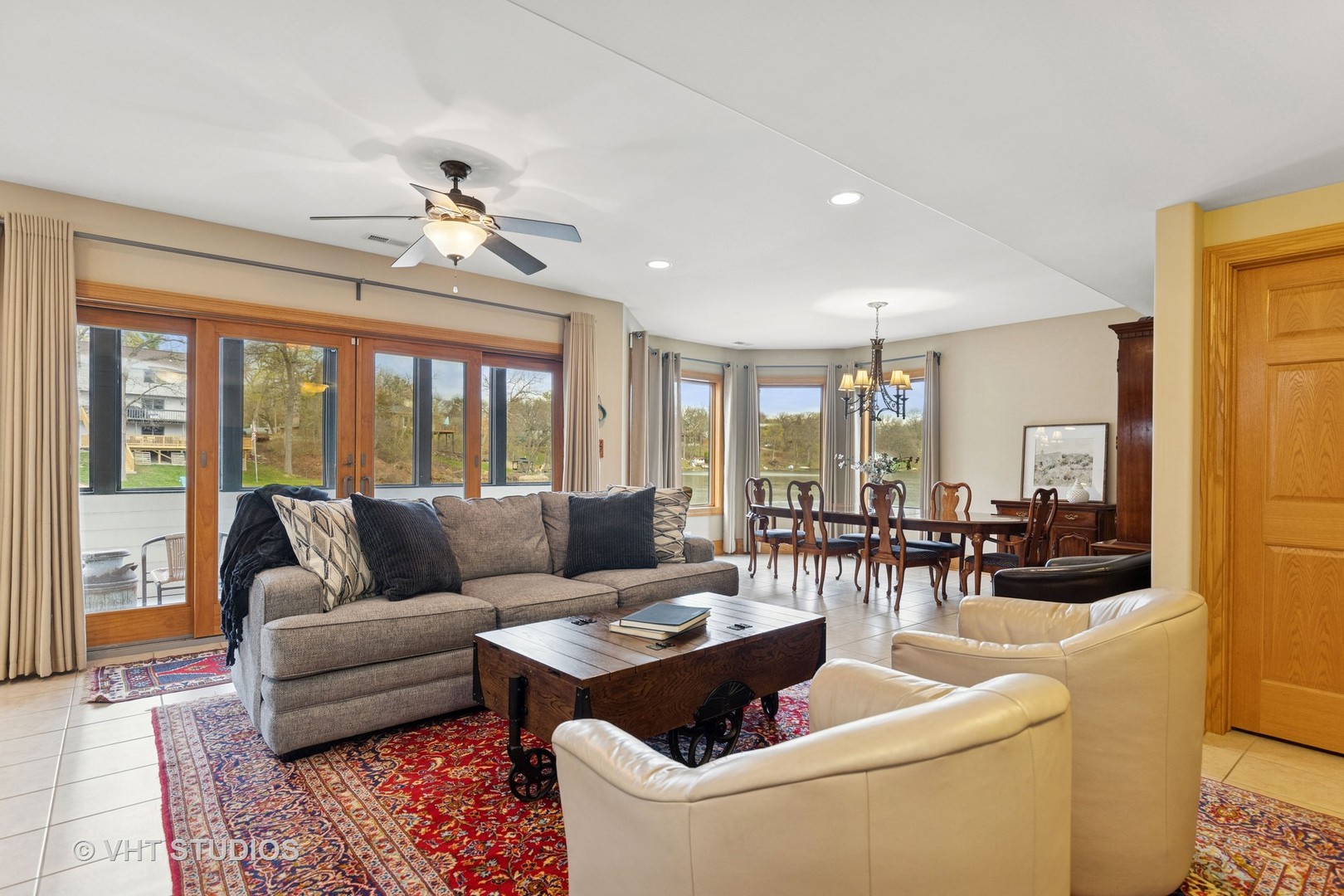 6107 Lake Shore Drive Cary, IL 60013 - Photo 29 of 40 a living room with furniture and a large window with garden view
