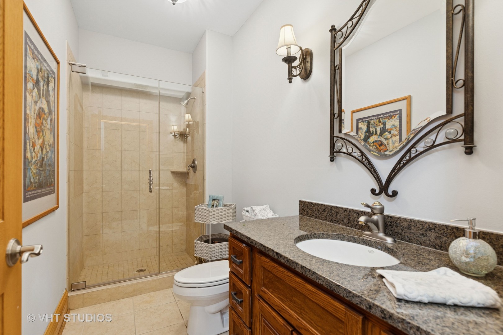 6107 Lake Shore Drive Cary, IL 60013 - Photo 35 of 40 a bathroom with a granite countertop sink toilet and shower