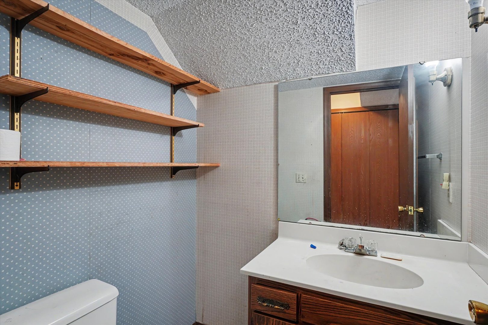 711 Higgins Road Champaign, IL 61822 - Photo 20 of 23 a bathroom with a sink a toilet and shower