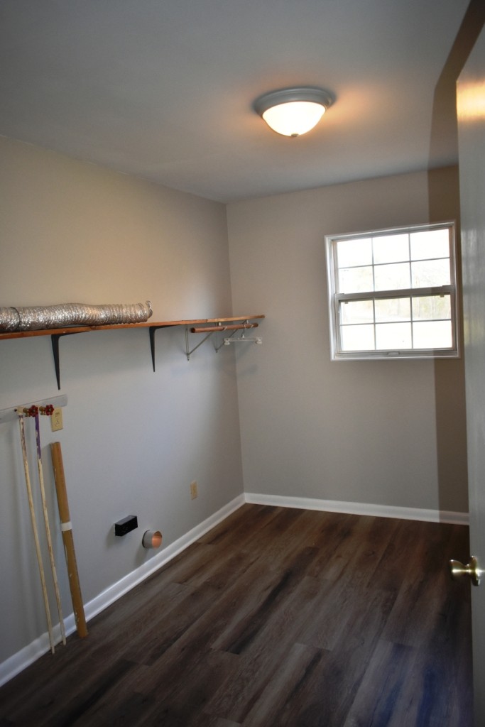 5 Dog Branch Road Pleasant Shade, TN 37145 - Photo 5 of 8 an empty room with wooden floor and windows