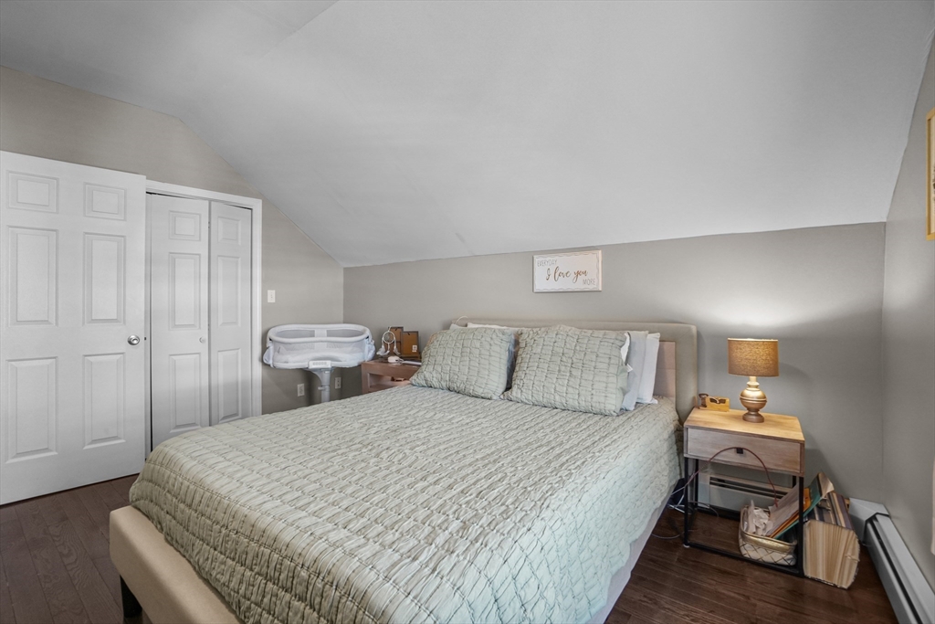 249 Baird Street Fall River, MA 02721 - Photo 11 of 23 a bed room with a bed and a chair