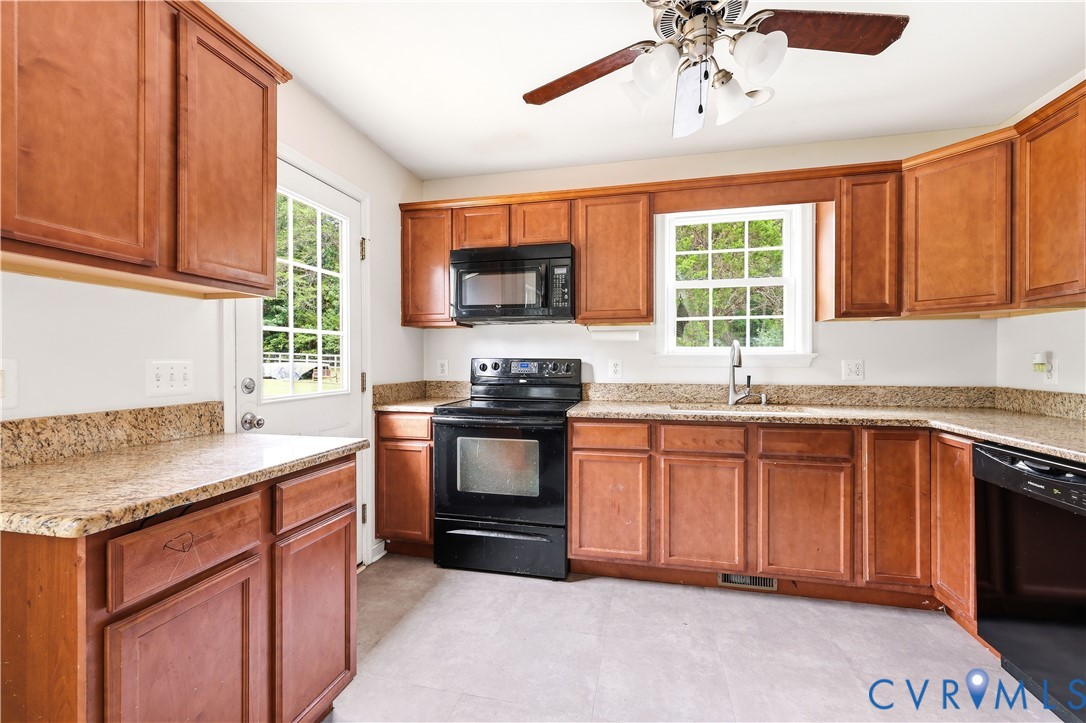 15490 Tyler Station Road Beaverdam, VA 23015 - Photo 16 of 45 Kitchen featuring extensive wood cabinetry, L-shap