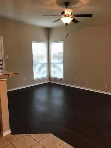 a view of wooden floor in an empty room