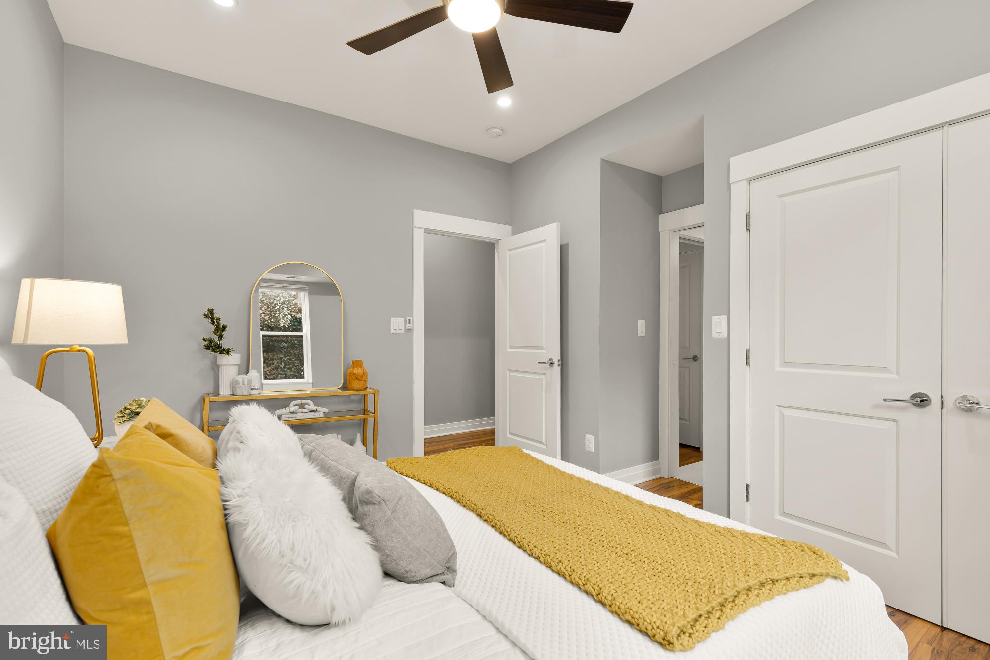 1719 Lincoln Road Northeast, Unit 1 Washington, DC 20002 - Photo 14 of 23 a spacious bedroom with a bed and a lamp