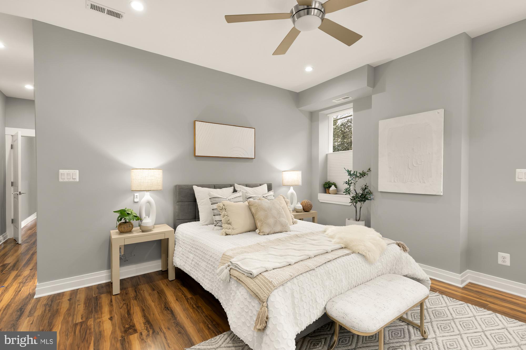 1719 Lincoln Road Northeast, Unit 1 Washington, DC 20002 - Photo 17 of 23 a bedroom with a bed and a chandelier