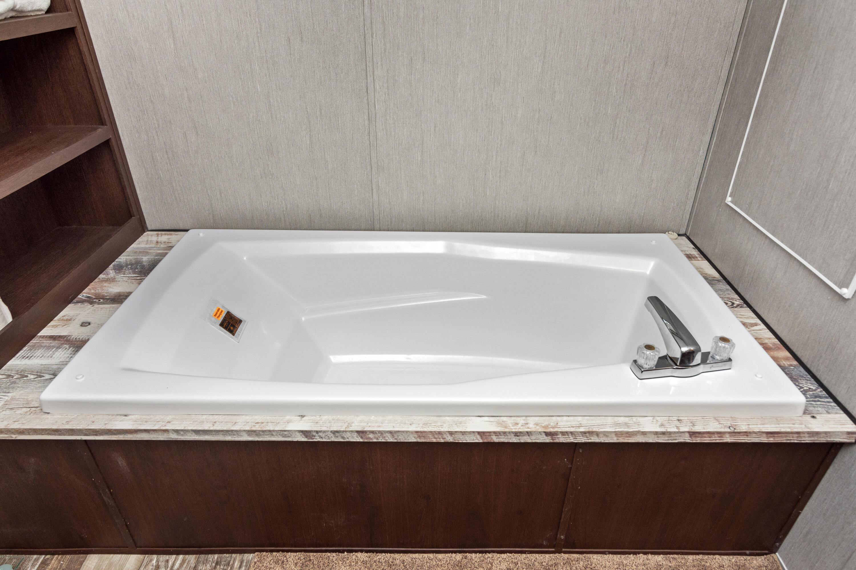3934 Chambray Road Crestview, FL 32539 - Photo 18 of 24 a bathroom with a sink and a bathtub