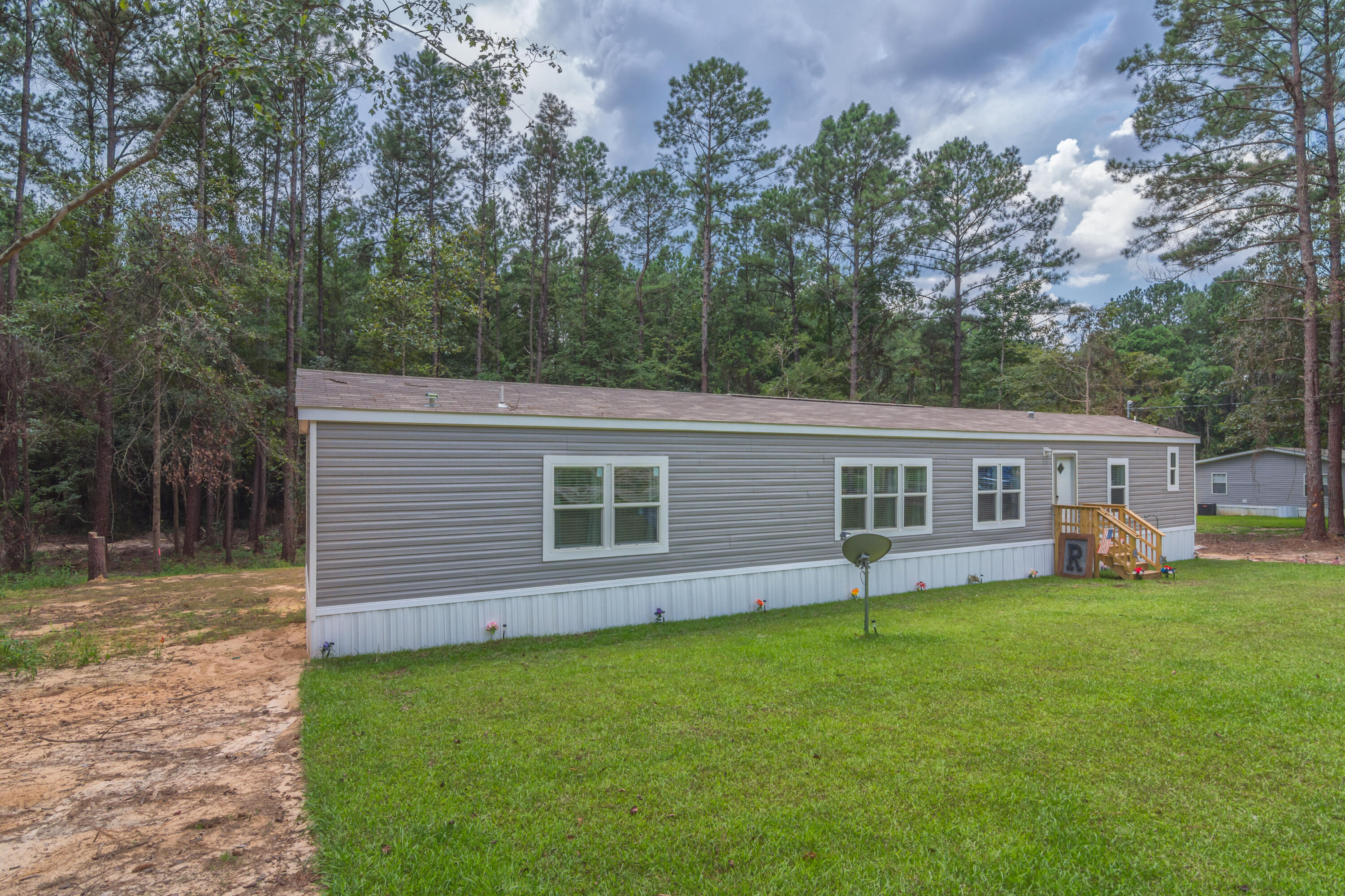 3934 Chambray Road Crestview, FL 32539 - Photo 2 of 24 a view of a house with a yard