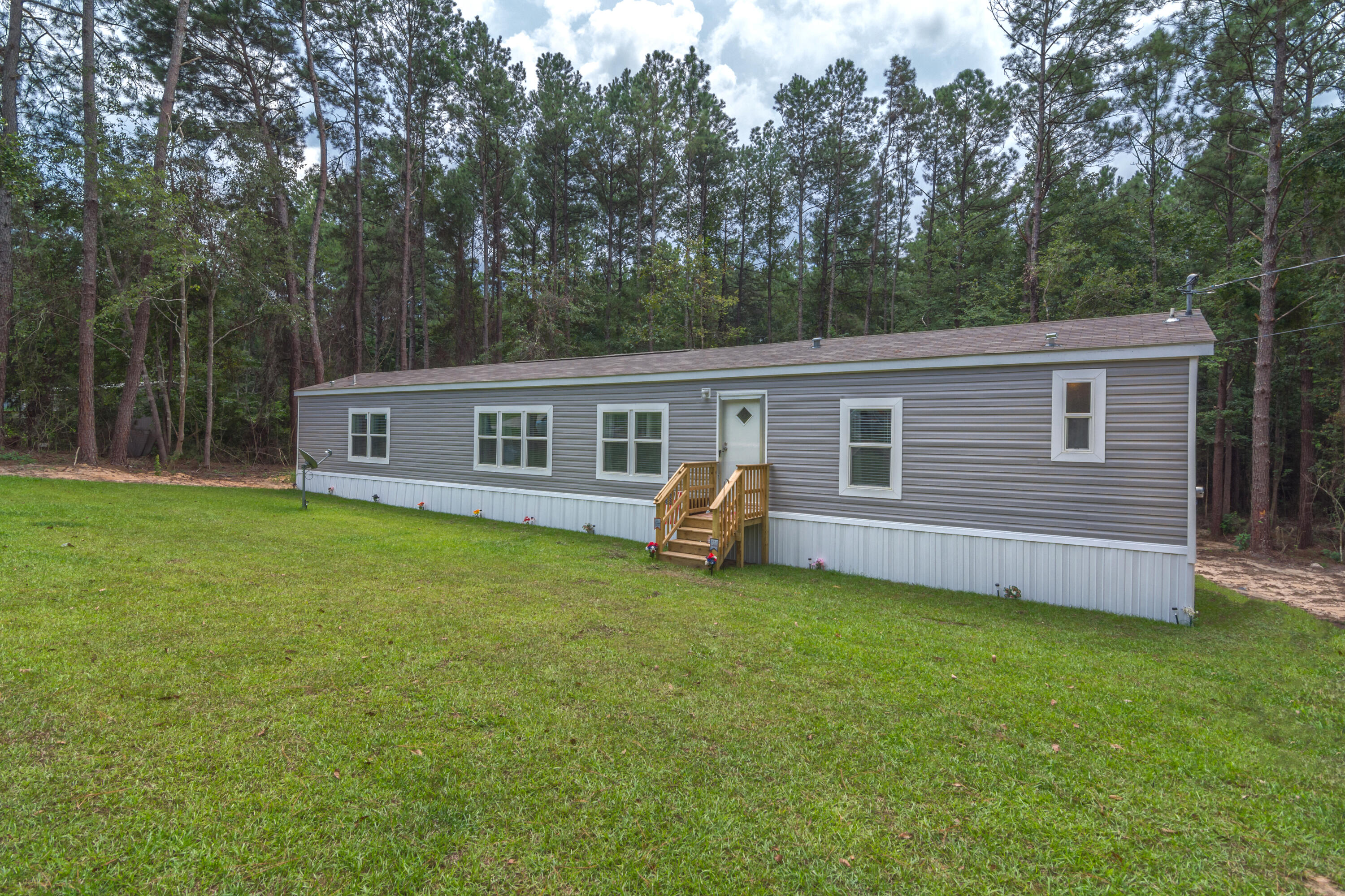 3934 Chambray Road Crestview, FL 32539 - Photo 3 of 24 a view of a house with a backyard