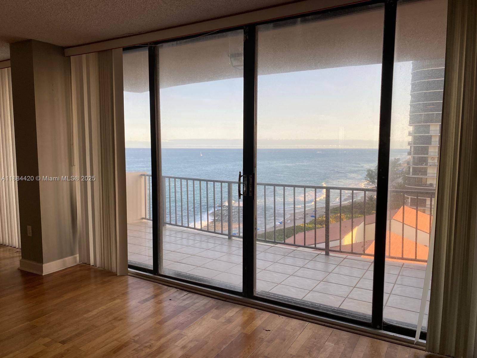 4200 North Ocean Drive, Unit 11103 Riviera Beach, FL 33404 - Photo 11 of 11 a view of a glass door and an outdoor space