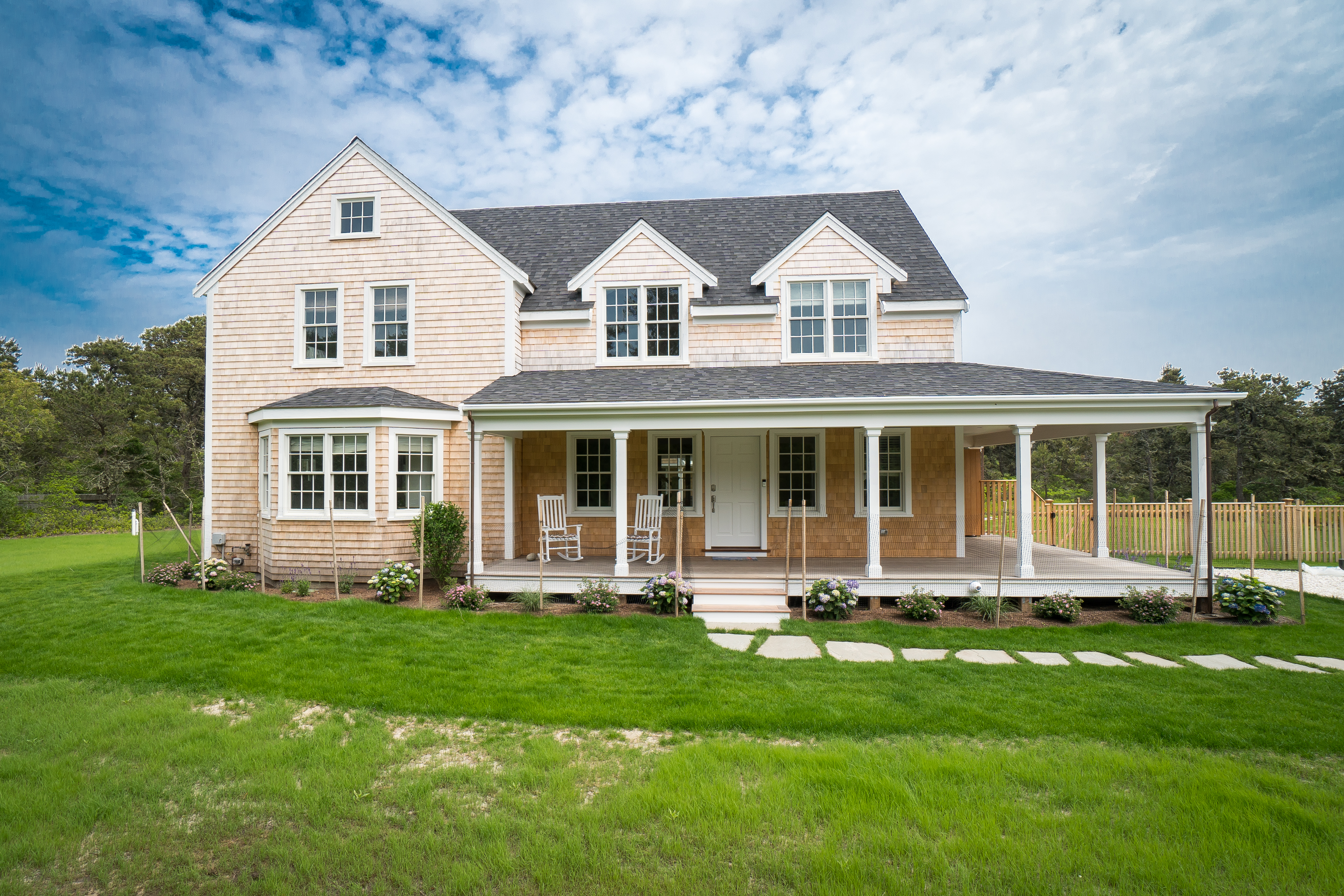 50 Lovers Lane Nantucket, MA 02554 - Photo 4 of 34 a front view of a house with a yard and trees