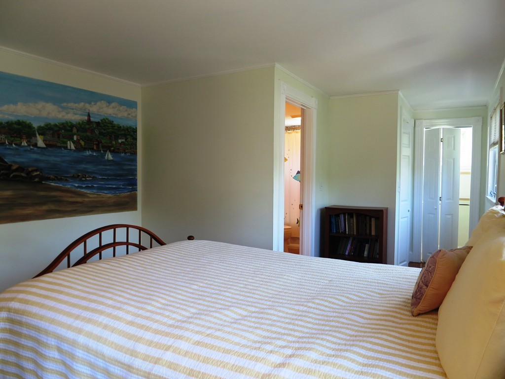 1 Rockland Road Marblehead, MA 01945 - Photo 8 of 11 a bedroom with a bed and a window
