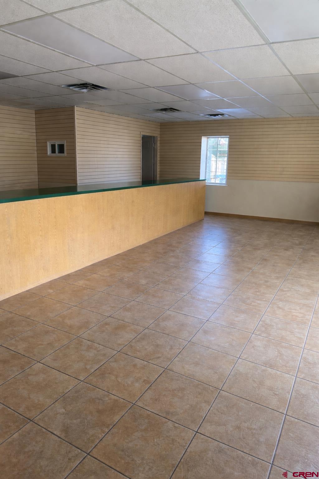 239 North 9th Street, Unit FIRST Montrose, CO 81401 - Photo 2 of 4 a view of an empty room with windows