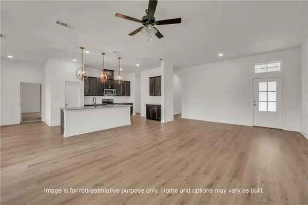 a view of a kitchen with a sink and a microwave