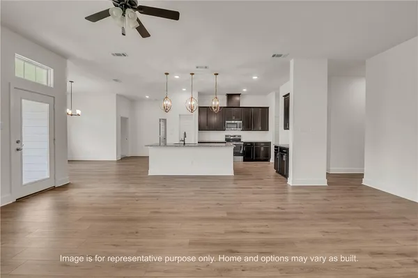 a view of kitchen and kitchen with stainless steel appliances