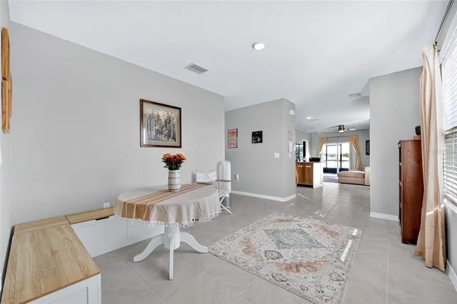 a work room with furniture and a wooden floor