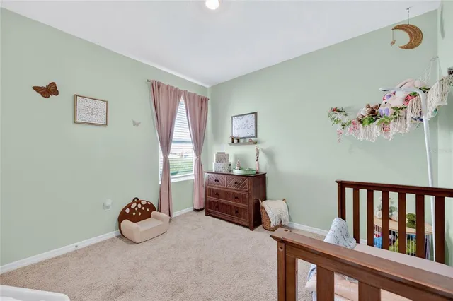 a bedroom with furniture and wooden floor