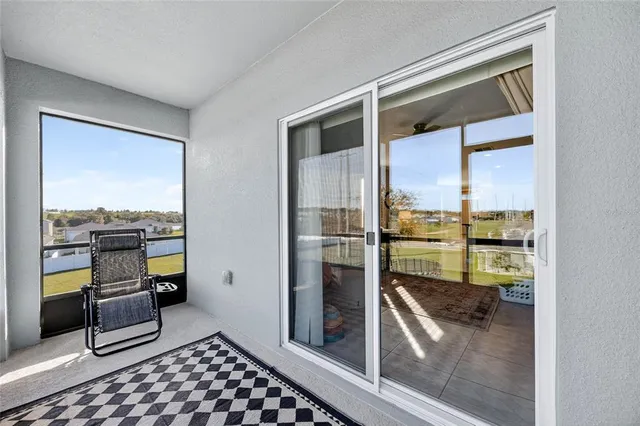 a kitchen with granite countertop a refrigerator and a sink