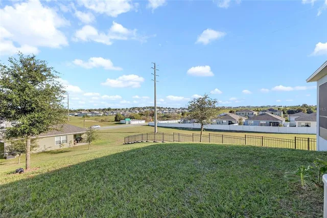 a view of a lake with a big yard