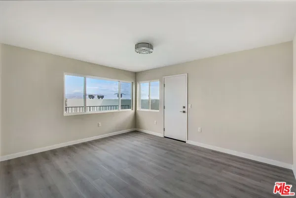 a view of a room that has a large window