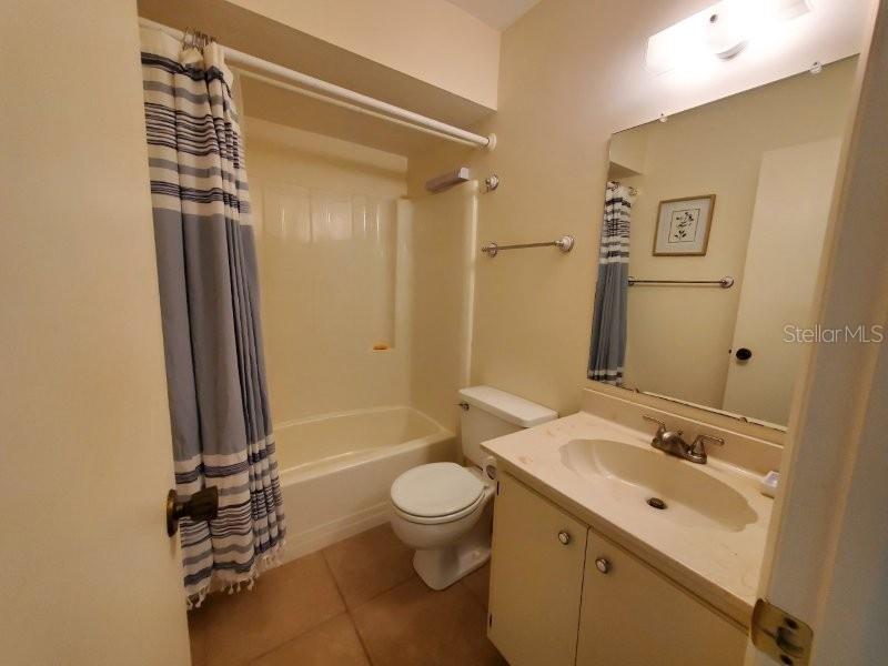 25275 Rampart Boulevard, Unit 1605 Punta Gorda, FL 33983 - Photo 11 of 16 a bathroom with a sink a toilet and shower