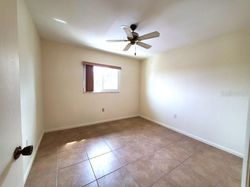 25275 Rampart Boulevard, Unit 1605 Punta Gorda, FL 33983 - Photo 12 of 16 a view of an empty room with a window