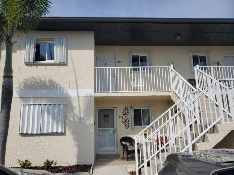25275 Rampart Boulevard, Unit 1605 Punta Gorda, FL 33983 - Photo 3 of 16 a view of staircase with white walls and windows