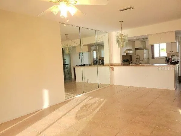a view of a kitchen with a sink and cabinets