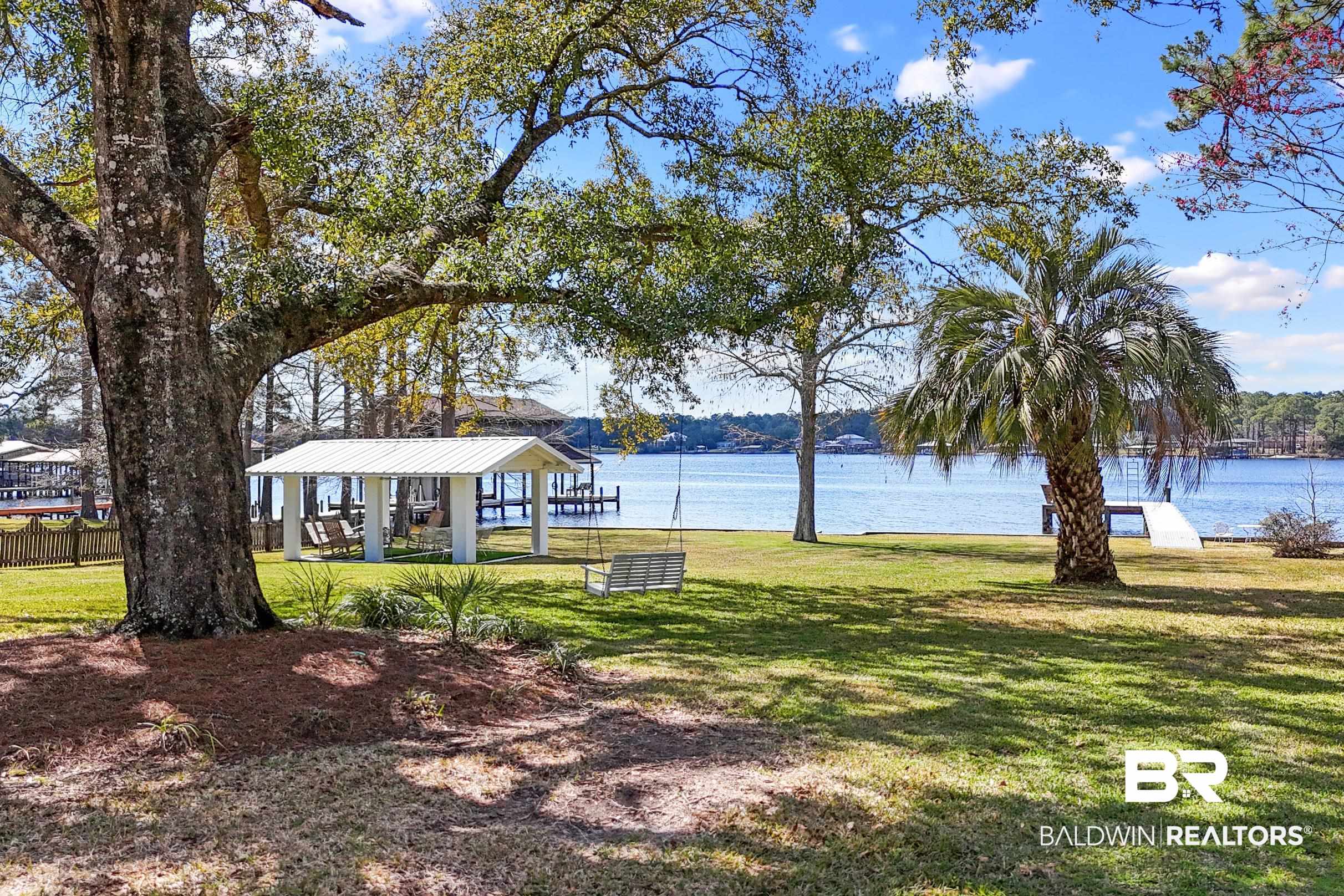 9459 Soldier Creek Road Lillian, AL 36549 - Photo 35 of 54 View of yard featuring a gazebo and a water view