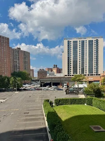 a view of a swimming pool and a yard