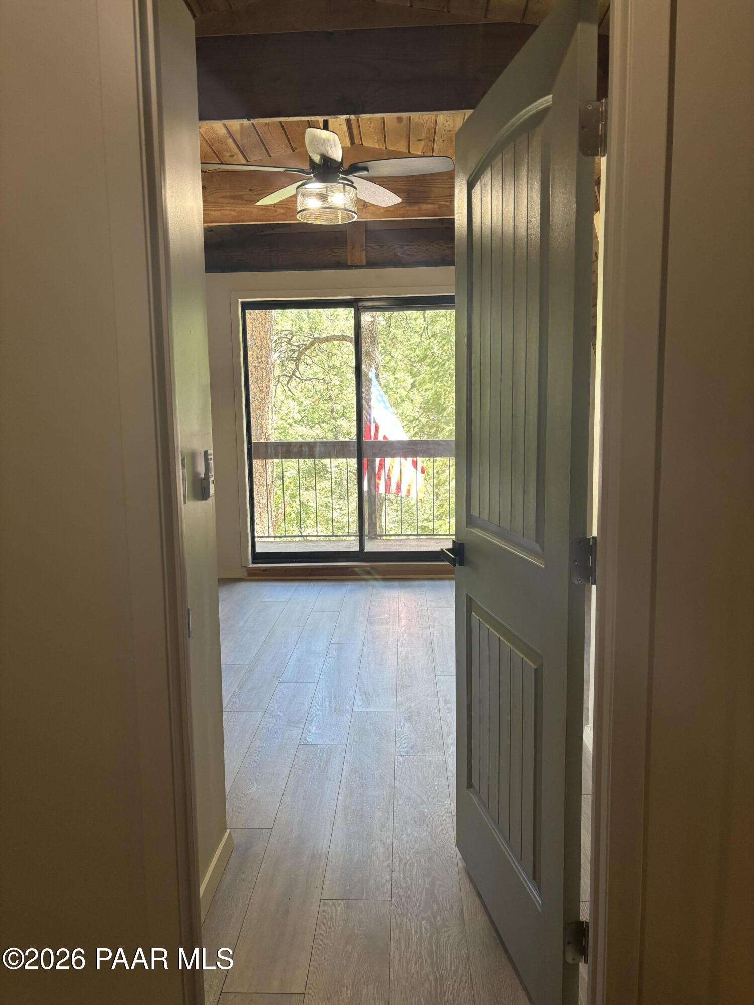 8550 South Breezy Pine Road Mayer, AZ 86333 - Photo 38 of 40 a view of empty room with wooden floor and fan