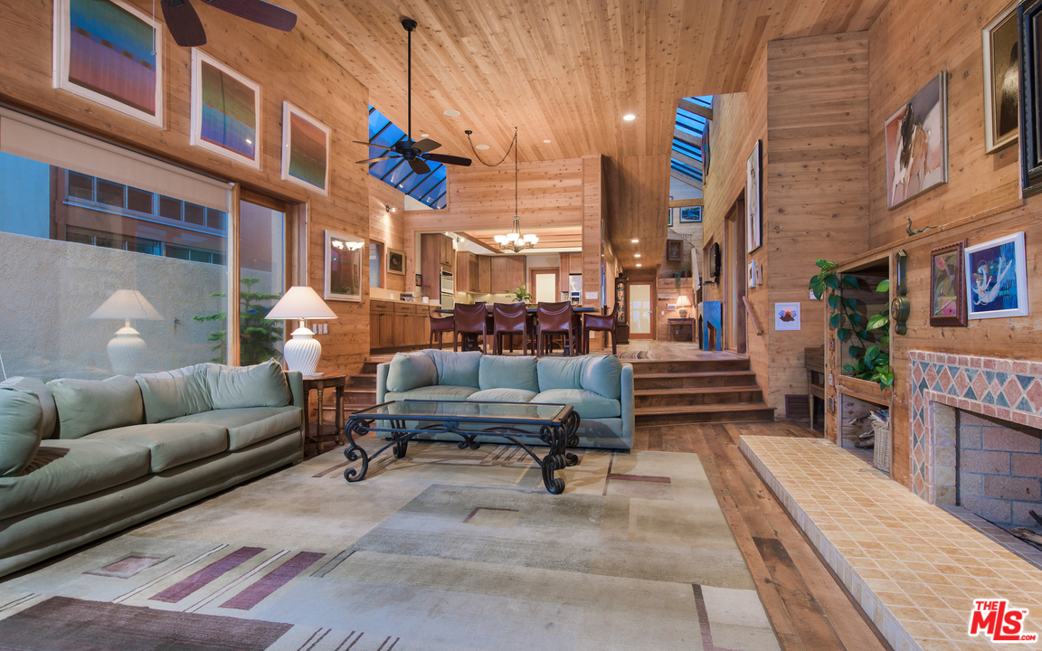 23768 Malibu Road Malibu, CA 90265 - Photo 11 of 23 a view of a patio with couches and a potted plant on a table