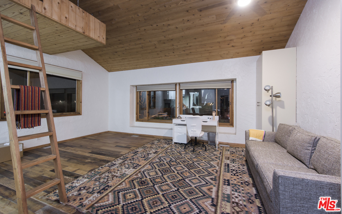 23768 Malibu Road Malibu, CA 90265 - Photo 18 of 23 a living room with furniture and a table