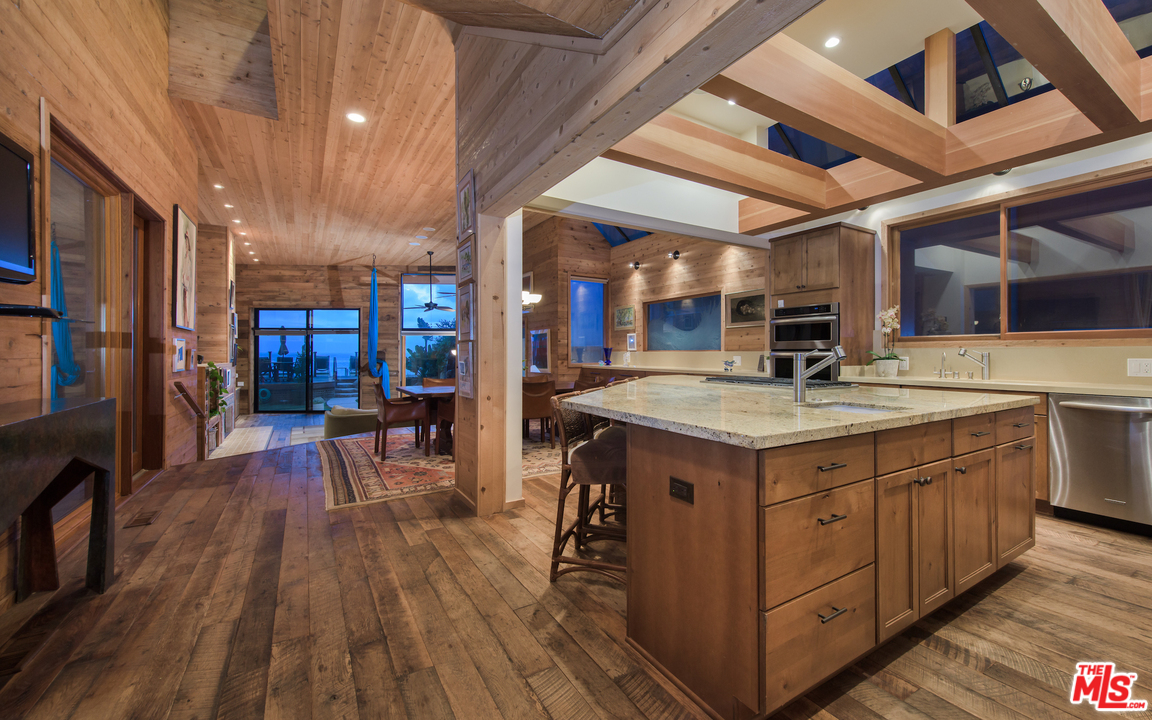 23768 Malibu Road Malibu, CA 90265 - Photo 8 of 23 a kitchen with a sink and wooden floor