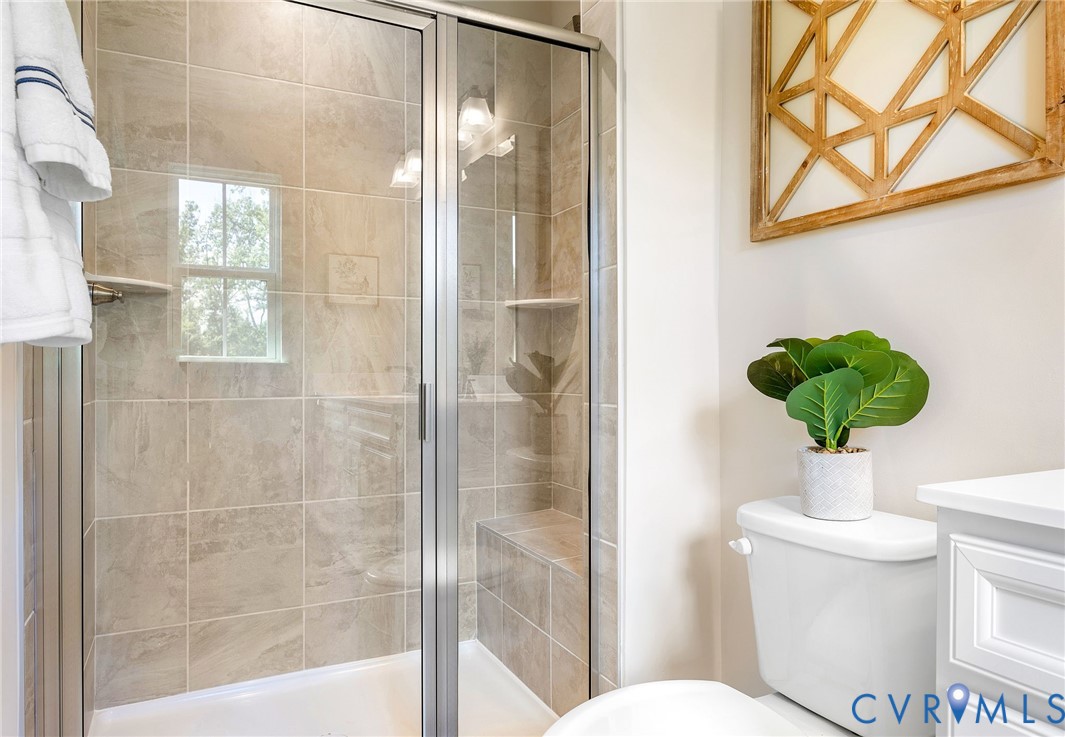 1255 Lazy River Road Midlothian, VA 23114 - Photo 18 of 27 a bathroom with a toilet shower and a sink